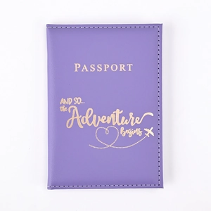 Detailed view of purple PU leather passport cover with gold adventure text and plane logo