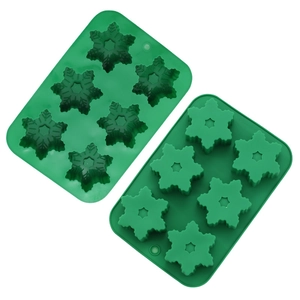 Detail view of two green silicone snowflake molds with 6 cavities for DIY chocolate and ice