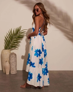 Detail of bohemian summer maxi dress with blue floral print and backless tie-up design