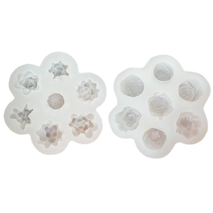 White silicone molds for succulent rose and peony shaped candles and fondant decoration