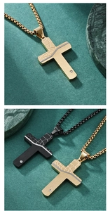 Detail of cross pendants with textured patterns and sparkling gemstones in black and gold