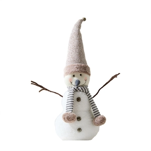 Christmas snowman plush doll ornament with knitted hat and branch-like hands on white background