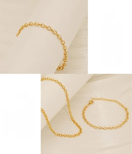 Detailed macro view of gold-plated stainless steel O-chain link with secure lobster clasp