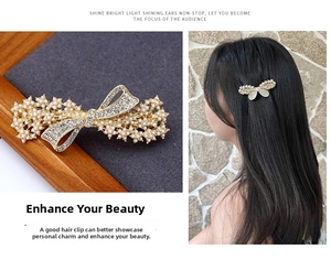 Detail of elegant bow hair clip featuring luxury pearls and rhinestones on gold alloy base