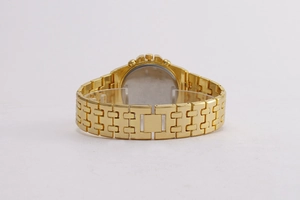 Rear view of luxury gold steel watch strap and circular casing on display stand