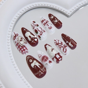 Cute bunny and strawberry press-on nails with red bows, pearls, and sparkling rhinestones