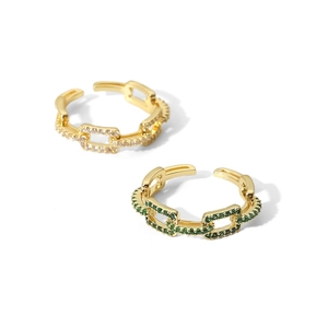 Close-up of adjustable 18K gold chain rings with white and green crystal zircon inlay