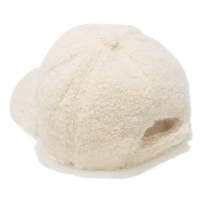 Close-up of cream faux fur texture and adjustable strap on a winter baseball cap