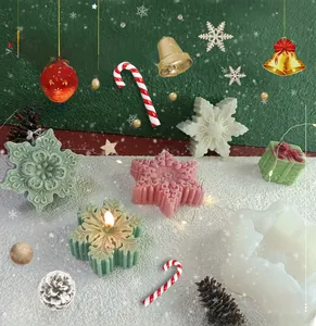 Detailed macro view of snowflake candle silicone mold with finished wax crafts