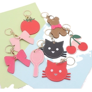 Variety of cute leather fruit and animal keychains with metal rings and hooks for bags