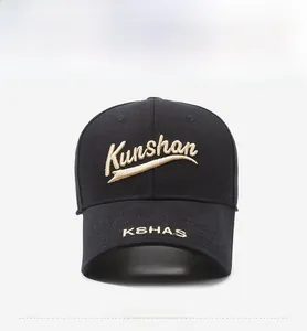 Front view of black baseball cap with detailed gold 3D embroidery and twill texture
