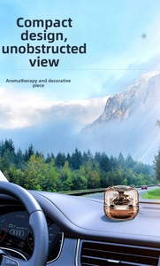 Solar rotating car aromatherapy ornament on dashboard with metallic bronze finish