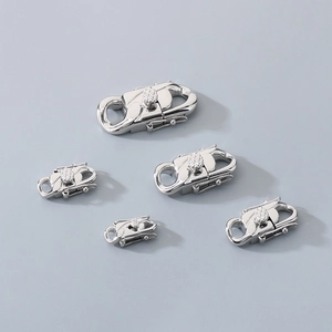 Detailed view of assorted silver stainless steel clasps in various sizes for jewelry making