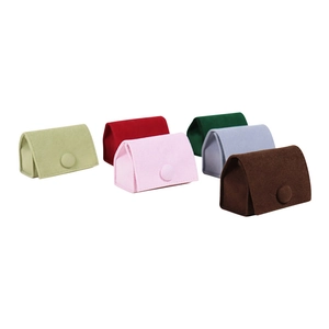 Set of six colorful velvet jewelry pouches with button closures on white background