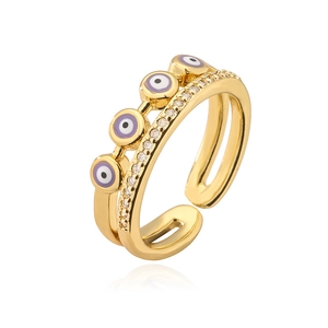 Detail of 18K gold plated evil eye ring with purple enamel and pavé zircon stones