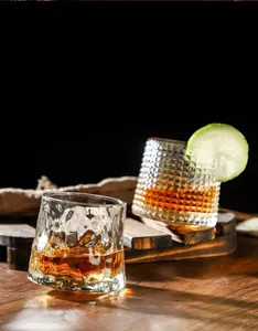 Detailed view of rotating whisky glasses with hammered and diamond crystal textures
