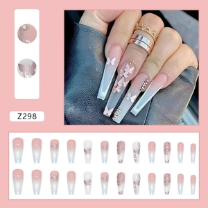 Pink and white gradient long ballerina press-on nails with butterfly and rhinestone accents