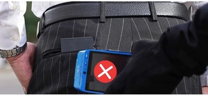 Close-up of slim RFID blocking wallet in back pocket showing anti-theft protection feature