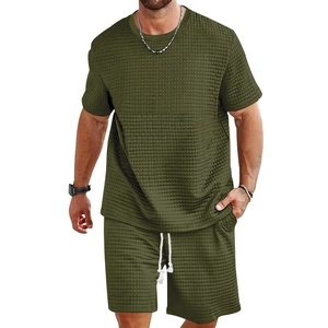 Detailed waffle knit fabric texture on men's olive green summer t-shirt and shorts set