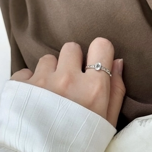 Minimalist silver lava texture ring featuring star engraving on a rectangular setting