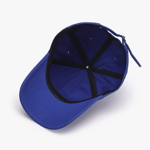 Royal blue cotton baseball cap showing interior stitching and adjustable back strap