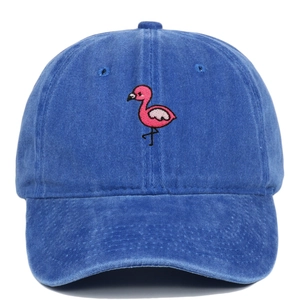 Close-up of pink flamingo embroidery on vintage washed navy cotton baseball cap