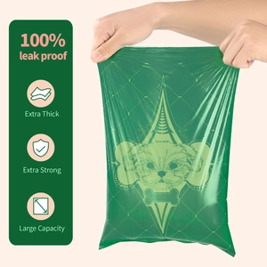 Durable green degradable pet waste bag being stretched to show extra thick leak-proof quality