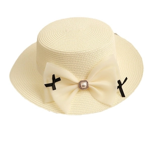 Flat top straw hat with large chiffon bow and pearl accent for summer sun protection