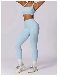 Detailed side view of light blue fitness yoga set with high waist leggings and sports bra