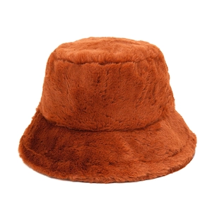 Detailed texture of thick caramel plush bucket hat made of warm rabbit hair imitation fabric