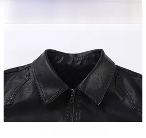 Détail de la veste en cuir noir montrant le col à revers classique et le zip métallique