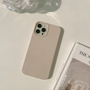 Detail of matte apricot silicone case for iPhone with water ripple shadows on surface