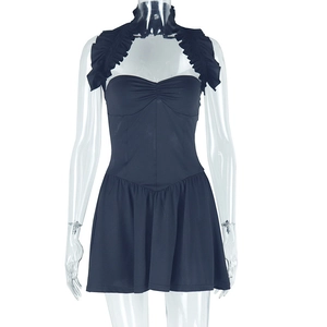 Close-up of black halter neck mini dress with ruffled neckline and open back detail