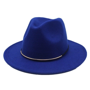 Detail of royal blue wool fedora hat with flat wide brim and gold metal buckle trim