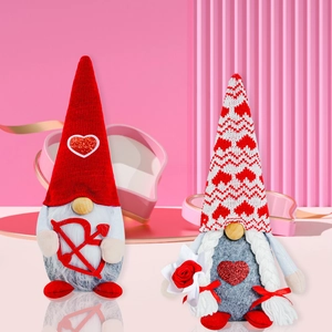 Pair of Valentine's Day gnomes with sequin heart hats and plush rose in pink setting