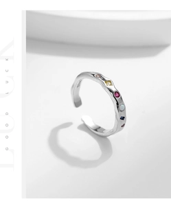 Macro shot of S925 sterling silver stamp and colorful stones on adjustable ring