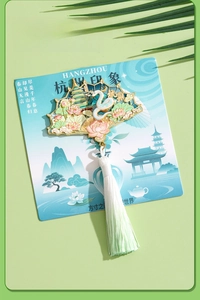 Exquisite fan-shaped West Lake souvenir with white snake, lotus, and silk tassel detail