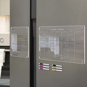 Magnetic acrylic weekly planner and to-do list with six colorful markers on a fridge