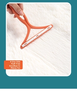 Detail showing the manual orange lint remover scraping pet hair off a long-pile rug