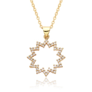 Detailed macro view of an 18k gold plated starburst pendant set with white zircons