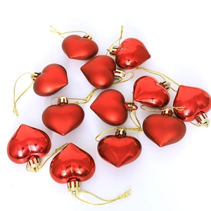 Set of 12 glossy red heart-shaped Christmas ornaments with gold hanging strings