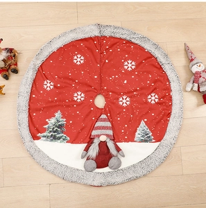 Detail of red Christmas tree skirt featuring a plush 3D gnome doll and white snowflake patterns