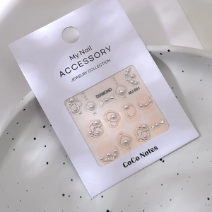 3D nail art sticker set with pearls and silver metal rings on white brand card