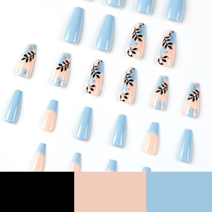 Blue and nude press-on nails with gold leaf and black leaf patterns in long coffin shape