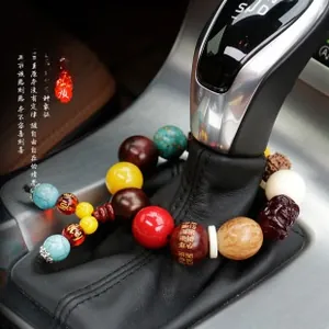 Car gear shift wrap featuring colorful Buddhist beads and lotus spacer detail