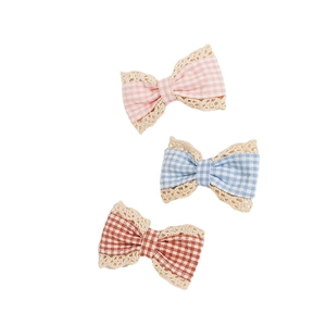 Three plaid fabric bows with beige lace trim in pink blue and reddish brown colors