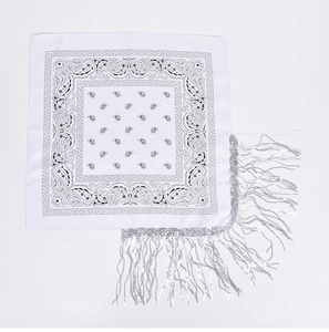 Detailed view of white paisley bandana with sparkling silver fringe and black patterns