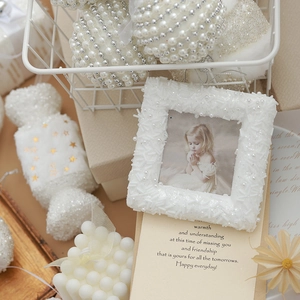 Elegant white Christmas tree ornament set featuring pearl baubles and plush candy pendants