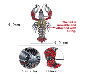 Detail showing movable tail joints and red rhinestones on the lobster brooch