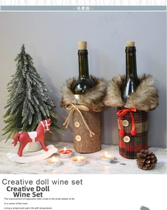 Detail of Christmas wine bottle covers with faux fur collars and bows for holiday decor